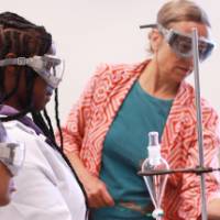 Camp facilitator with students